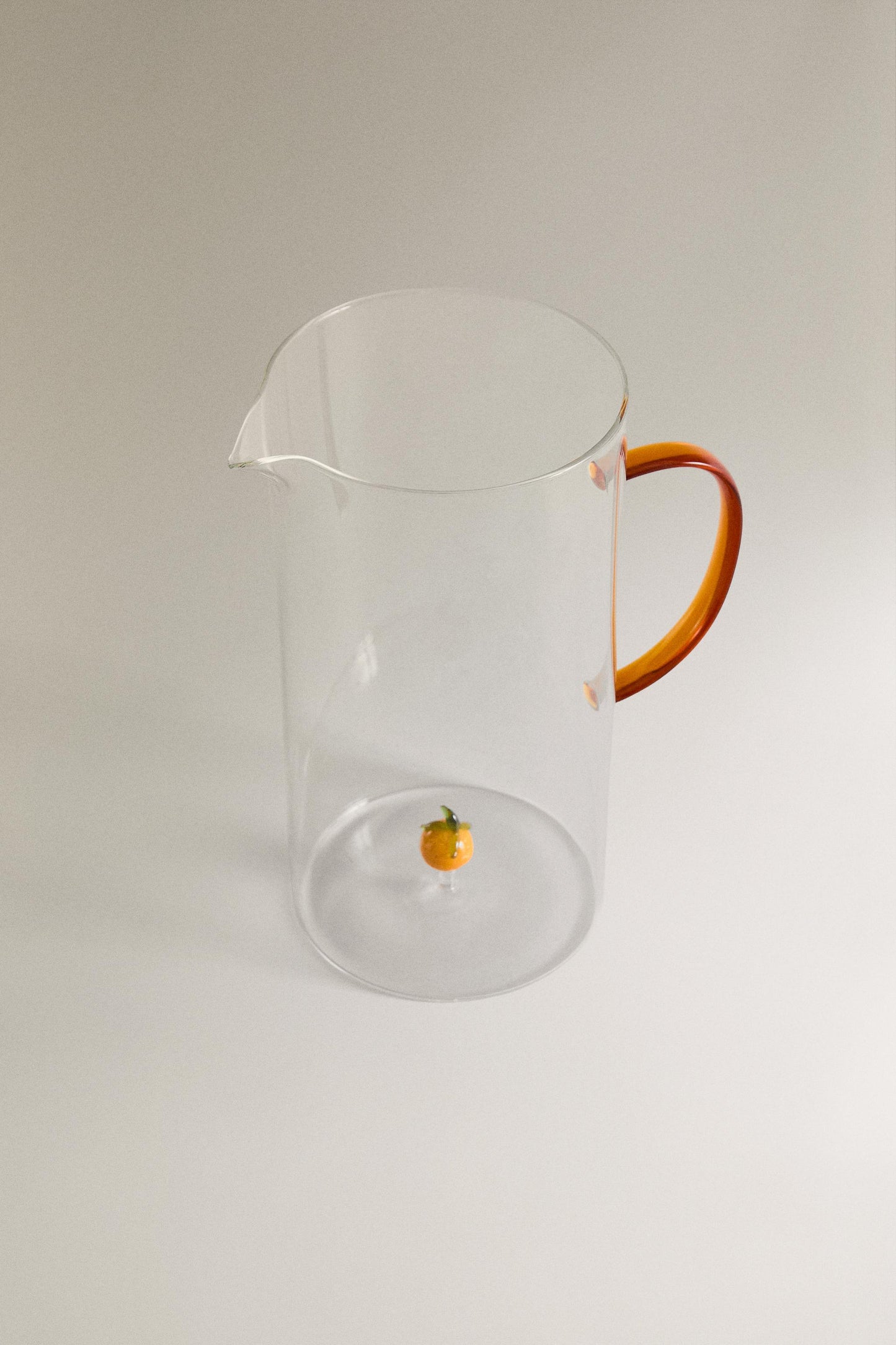 Drinkware, pitcher, borosilicate glass, orange figure inside
