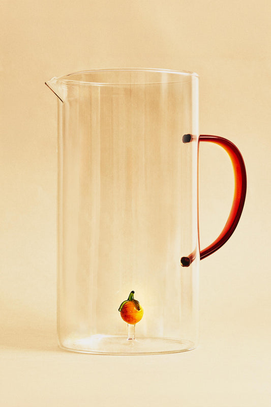 Drinkware, pitcher, borosilicate glass, orange figure inside