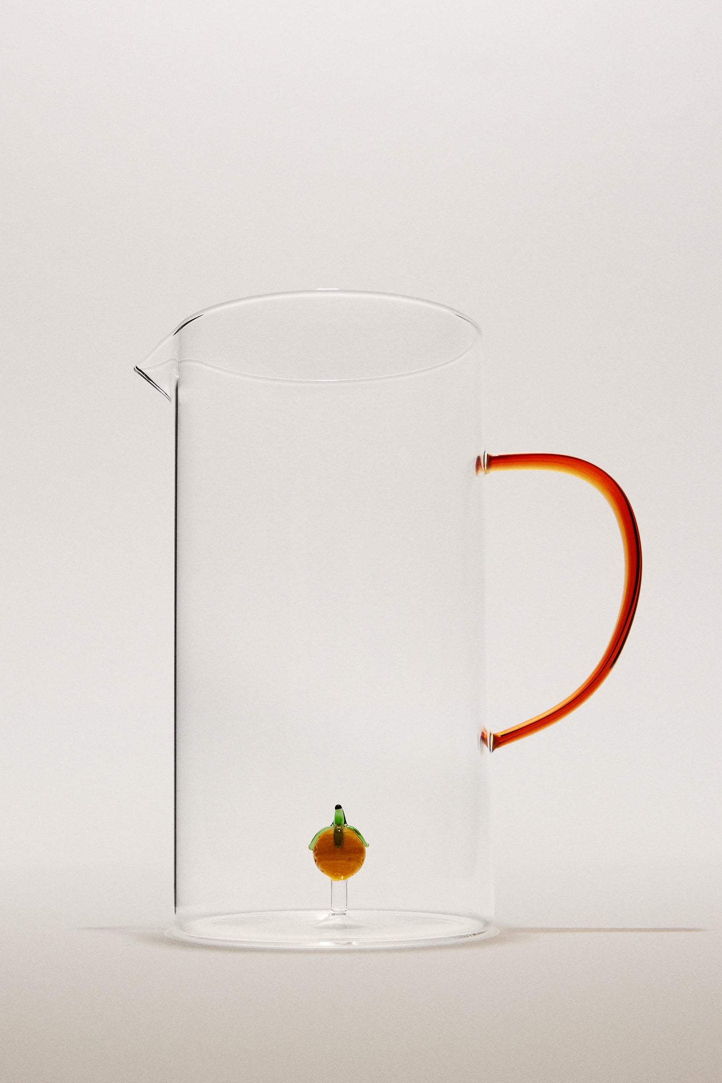Drinkware, pitcher, borosilicate glass, orange figure inside