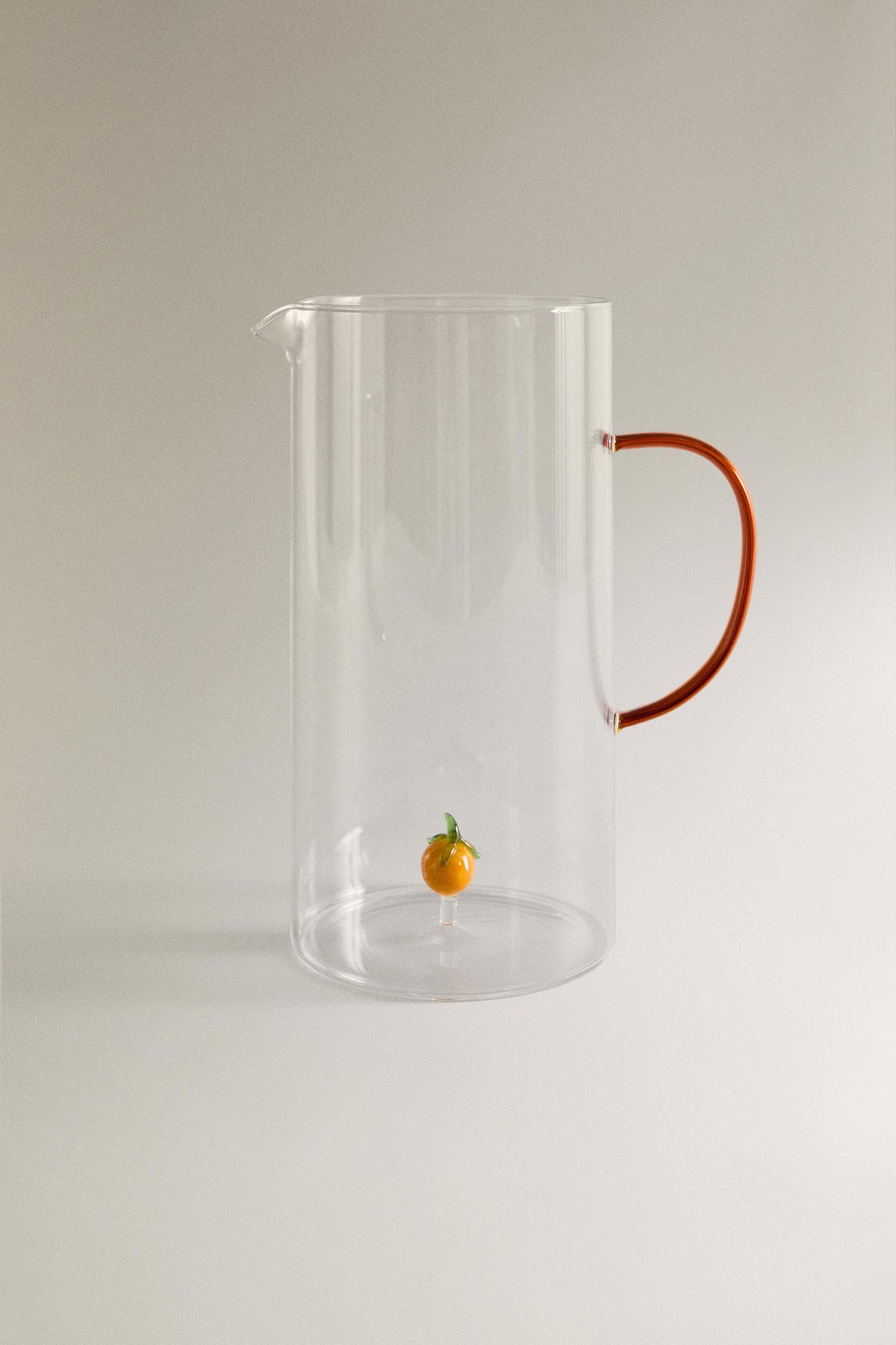 Drinkware, pitcher, borosilicate glass, orange figure inside