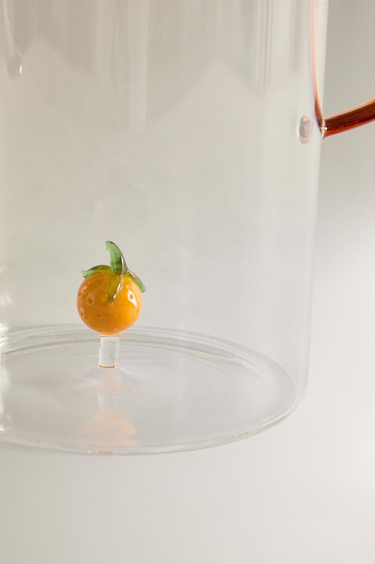 Drinkware, pitcher, borosilicate glass, orange figure inside